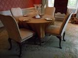 Dining Room:  Round 48" maple table with round fringed tablecloth; four NEW BAKER chairs; four French plates; crystal compote on mirror tray; a 12" x 15" carved Chinese 100% wool rug.