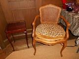 Library:  A small side table; cane back French-style chair (as is).