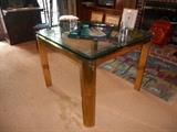 Library:  A thick glass top/brass base 36" x 36"  table (great use as a game table).