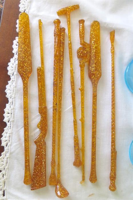 Vintage glittered drink stirrers. Oars, rifle, golf clubs, fishing pole...