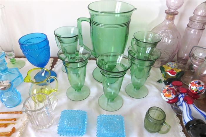 Green glass pitcher and glasses