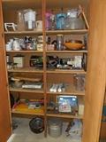 lots of items in garage cabinet