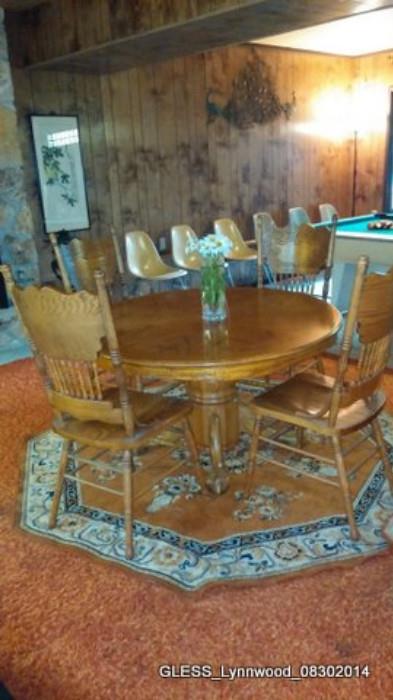 Original Heman Miller Fiberglass Egg Chairs (8 total), Round Oak Style Dining Table and Chairs (replica).