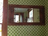 This is a hat rack hall mirror with beveled glass and original hand painted flowers. Original hardware. Beautiful! 
