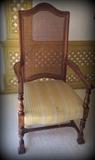 Antique cane back chair with fabulous wood carving detail!