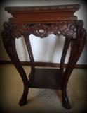 Gorgeous antique wooden table with ornate wood carving and paw feet!