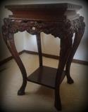 Gorgeous antique wooden table with ornate wood carving and paw feet!
