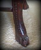 Gorgeous antique wooden table with ornate wood carving and paw feet!
