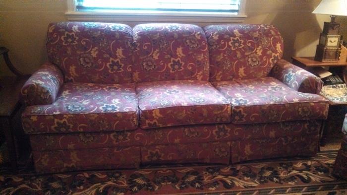 Living room couch, has matching chair. 