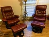Pair of leather rocker/recliners with ottoman, 1888 brass-base lamp with cherub-face globe