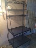 Wrought-iron baker's racks, one black, one white