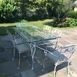 Classic wrought iron table with beveled-glass top and 6 chairs (never rust)