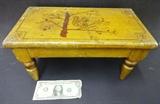 Small stool in orig. buttermilk paint w/squirrel decoration