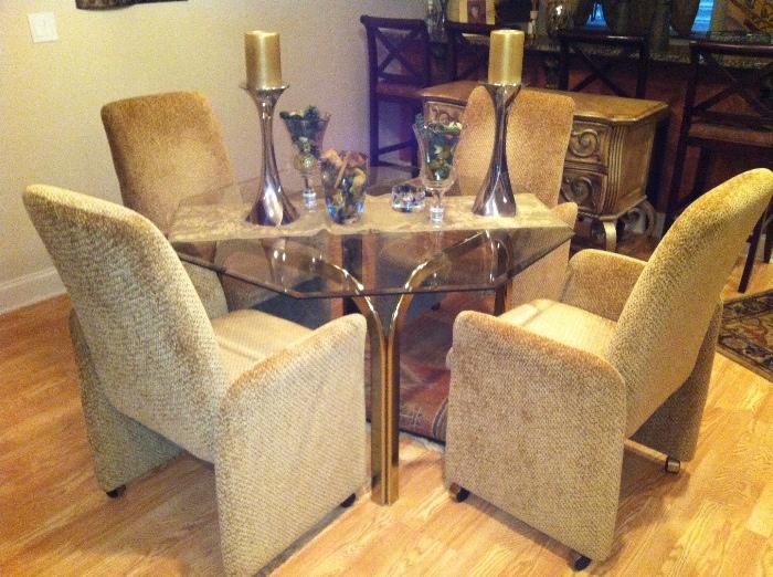 Four Custom Upholstered Matching Chairs on Rollers with Octagonal Brass and Glass Top Dining Table