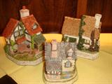 David Winter Cottages. One of David's quaint habits is to sculpt a mouse or owl onto his cottages and castles.