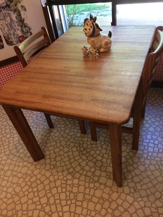 Oak table in pristine condition with pads and leaf. 