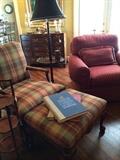 Upholstered chair with matching ottoman; table floor lamp; red club chair