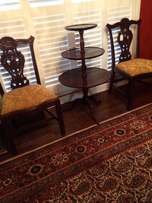     Two of the 12  Chippendale chairs; tiered table
