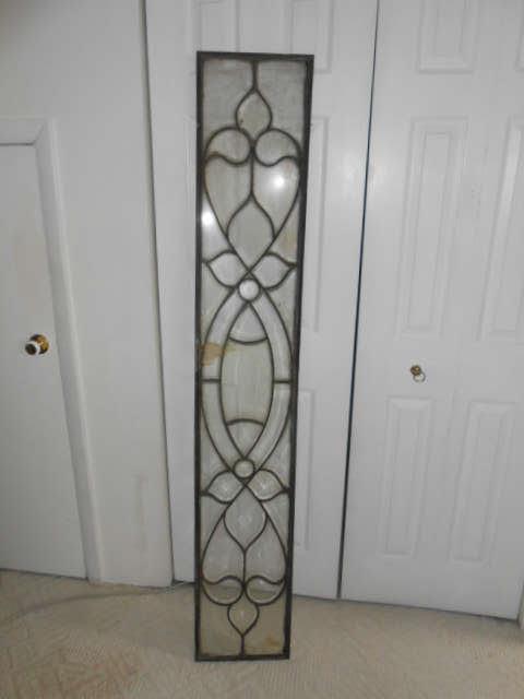 Beveled and leaded glass window panel. Approx 5' tall by 10"inches