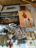 Pin up art, ribbon bars, military decorations, novelty men's jewelery, watches, cuff links and lighters.