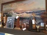 Various trophies and a Eugene Garin print.