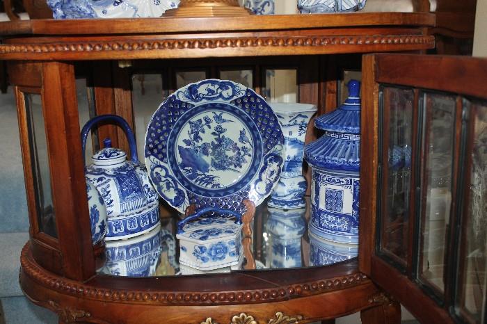 Cabinets are everywhere and are all full!  Elegant Blue & White Transferware throughout the entire house and yard.