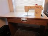 Sewing machine in table.