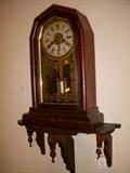 Welch 30 hour clock on walnut shelf.  Clock in running condition at this time.