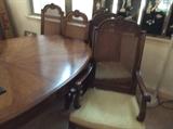 Henredon table with two leaves, and 6 chairs, cane back, excellent condition
