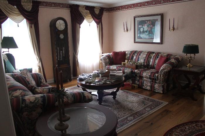 Living furniture in great shape. Grandfather clock, lamps, coffee table, rugs, sconces, floor lamp.