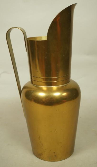 Lot 16  -  TOMMI PARZINGER Brass Pitcher. Modernist form with large flared spouts. Art Deco form. Marked.-- Dimensions:  H: 12 inches: W: 5.5 inches --- 
