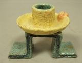 Lot 29  -  WIENER WERKSTATTE Ceramic Candlestick. Polychrome Glazed Redware. Marked WW; made in Austria.-- Dimensions:  H: 3 inches: W: 2.5 inches: D: 4 inches --- 