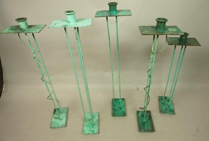 Lot 43  -  5pc SWID POWELL Patinated Memphis Candlesticks. Tall wiry candlesticks with thin rods and curly details. Green oxidized patina finish. Marked S. HALL for Swid Powell. -- Dimensions:  H: 21 inches: W: 4.75 inches --- 
