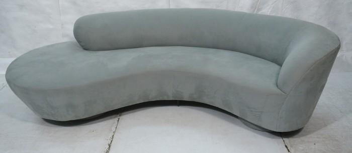 Lot 48  -  VLADIMIR KAGAN for Directional Serpentine Sofa Couch. Pale blue upholstery. Two pedestal bases with lucite center support. Directional label.-- Dimensions:  H: 29 inches: L: 96 inches --- 