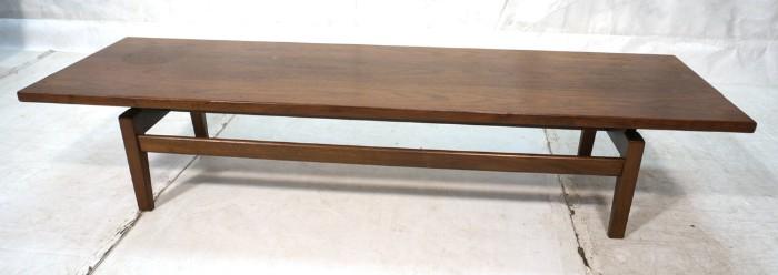 Lot 60  -  JENS RISOM American Modern Walnut Coffee Table. Square legs with raised overhanging top. Marked.-- Dimensions:  H: 15 inches: W: 72 inches: D: 21 inches --- 