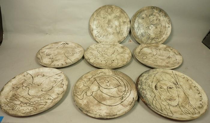 Lot 75  -  Set 8 After Picasso Pottery Plates.  Vallauris D'apres Picasso.  Artist signed. 1 is different not marked the same, Portrait of woman.-- Dimensions:  H: 10.25 inches --- 