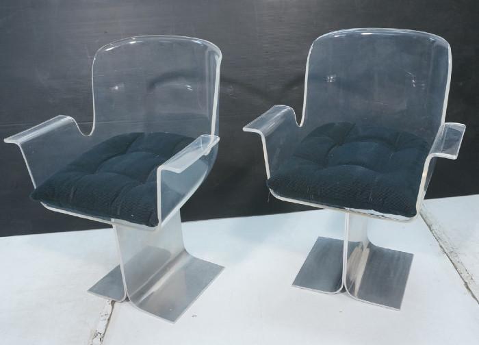 Lot 93  -  Pair Laverne Style Arm Chairs.  Molded Lucite in Flared Aluminum base.-- Dimensions:  H: 32.5 inches: W: 24 inches: D: 23 inches --- 