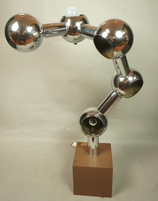 Lot 107  -  70's Modern Chrome Table Lamp.  Ball and tube on brown metal base.  Helix form.-- Dimensions:  H: 31 inches: W: 20 inches: D: 12.5 inches --- 