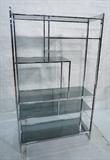 Lot 137  -  Milo Baughman Chrome Etagere with Smoked Glass Shelves.  Flat chrome frame.-- Dimensions:  H: 72 inches: W: 62.25 inches: D: 16.25 inches --- 