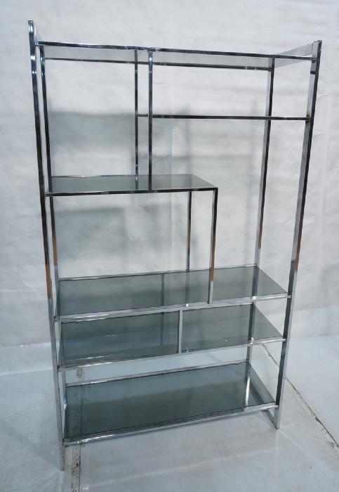 Lot 137  -  Milo Baughman Chrome Etagere with Smoked Glass Shelves.  Flat chrome frame.-- Dimensions:  H: 72 inches: W: 62.25 inches: D: 16.25 inches --- 