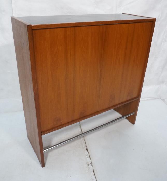 Lot 153  -  ERIC BUCK Danish Teak Bar. Sliding glass doors. interior fitted for bottles. Chrome foot bars.-- Dimensions:  H: 45.25 inches: W: 43 inches: D: 16 inches --- 