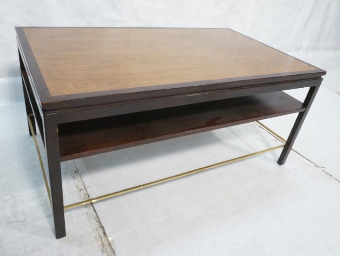 Lot 190  -  DUNBAR Rosewood Banded Walnut Coffee Table. Two tier cocktail table. Brass stretchers. Metal Dunbar tag-- Dimensions:  H: 22 inches: W: 48 inches: D: 28 inches --- 