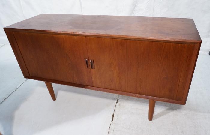 Lot 202  -  Danish Teak Tambour Door Cabinet Credenza. Wood pulls. Tapered peg legs. Interior with drawers and shelves. Danish tag. -- Dimensions:  H: 31.5 inches: W: 59 inches: D: 19 inches --- 