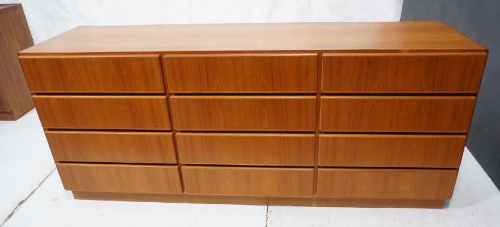 Lot 206  -  Twelve drawer Danish Modern Teak Dresser. Metal Danish Control tag. Skirted base. -- Dimensions:  H: 31 inches: D: 19 inches: L: 72 inches --- 