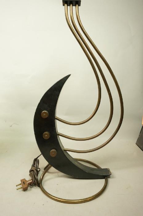 Lot 214  -  Modernist Wood & Metal Table Lamp. Crescent Moon shape with three metal rod arms. Circle rod base. -- Dimensions:  H: 27 inches --- 