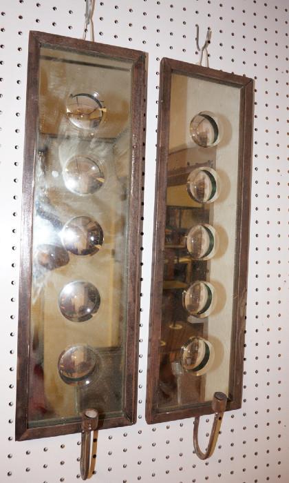 Lot 217  -  Pr Fornasetti style Iron  Mirrored Candle Sconces. Mirrors have incised dimples. Iron Frames. -- Dimensions:  H: 26 inches: W: 7 inches --- 