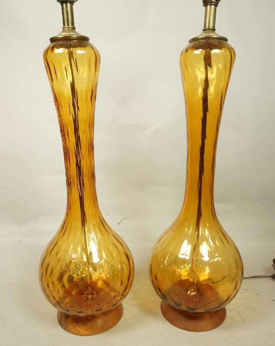 Lot 224  -  Pr Modernist Gold Glass Table Lamps. Bowling Pin  form glass. Wood bases.-- Dimensions:  H: 34 inches: W: 9 inches --- 