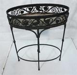 Lot 235  -  Vintage Iron Oval Planter Stand. Decorative Ironwork. Four leg base. Painted black-- Dimensions:  H: 33 inches: W: 26 inches: D: 15 inches --- 