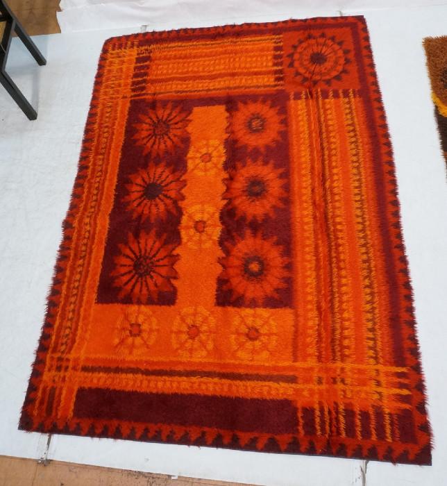 Lot 255  -  Room Size Shag Rug Carpet. Reds, oranges and burgundies. Central floral design. Not marked. -- Dimensions:  H: 90 inches: W: 64 inches --- 