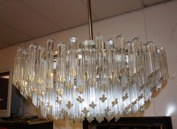 Lot 259  -  Venini style Prism  Hanging Chandelier. Elliptical shape. Four lobed prisms. Camer.-- Dimensions:  H: 14.5 inches: W: 34 inches: D: 17 inches --- 